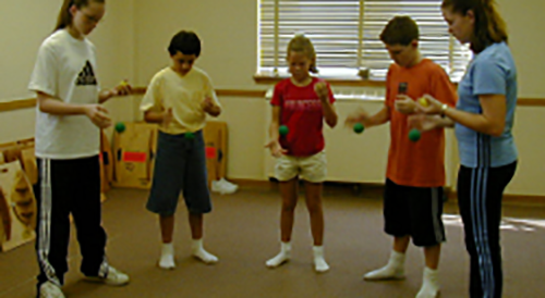 children in a circle playing